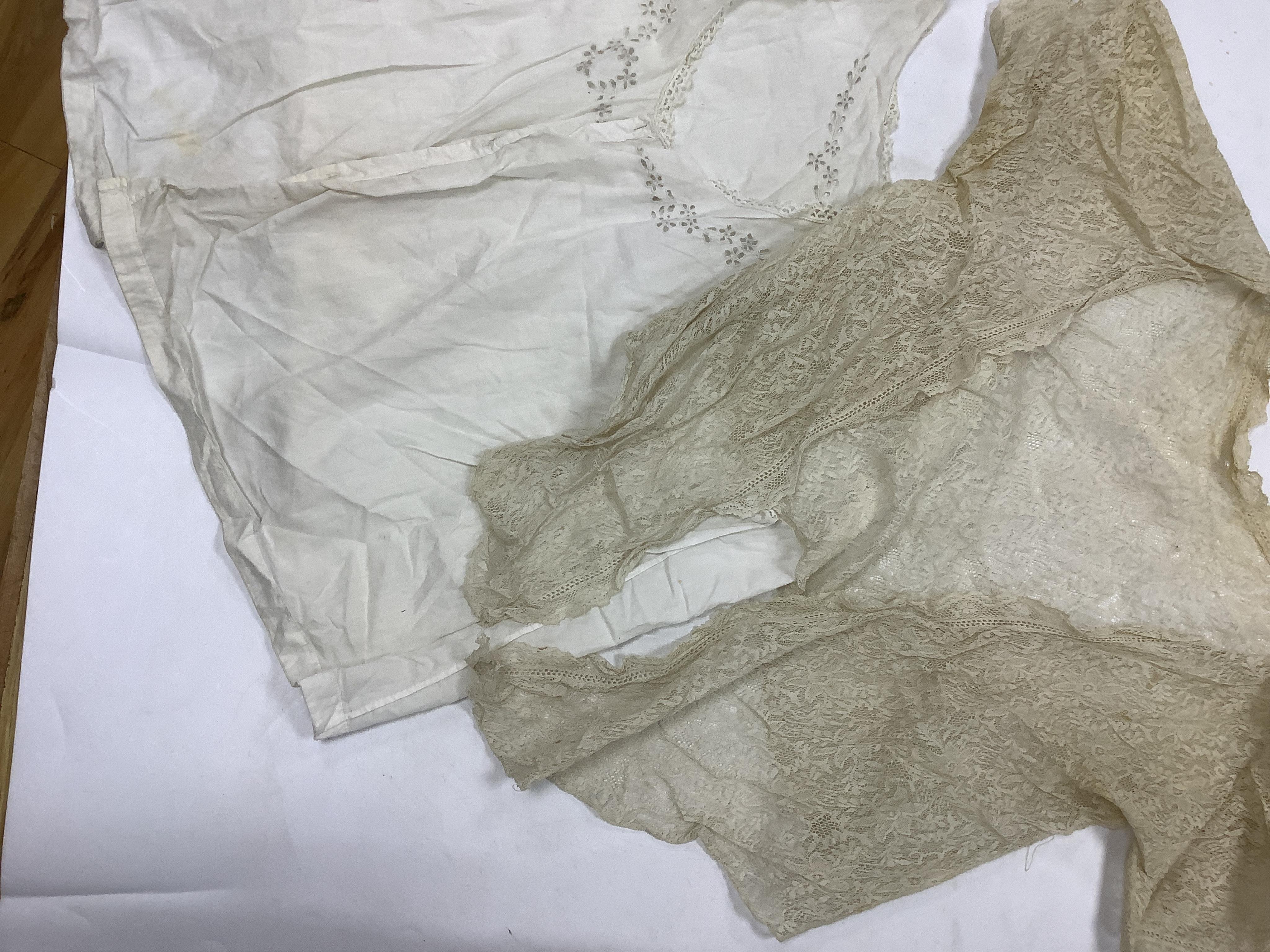 Two Edwardian blouses and three earlier lace camisoles, three black satin partly sewn skirts and later black velvet diamonte decorated evening coat. Condition - the coat, skirts and blouses need repair but are good for T